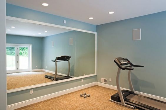 home gym with three framed mirrors
