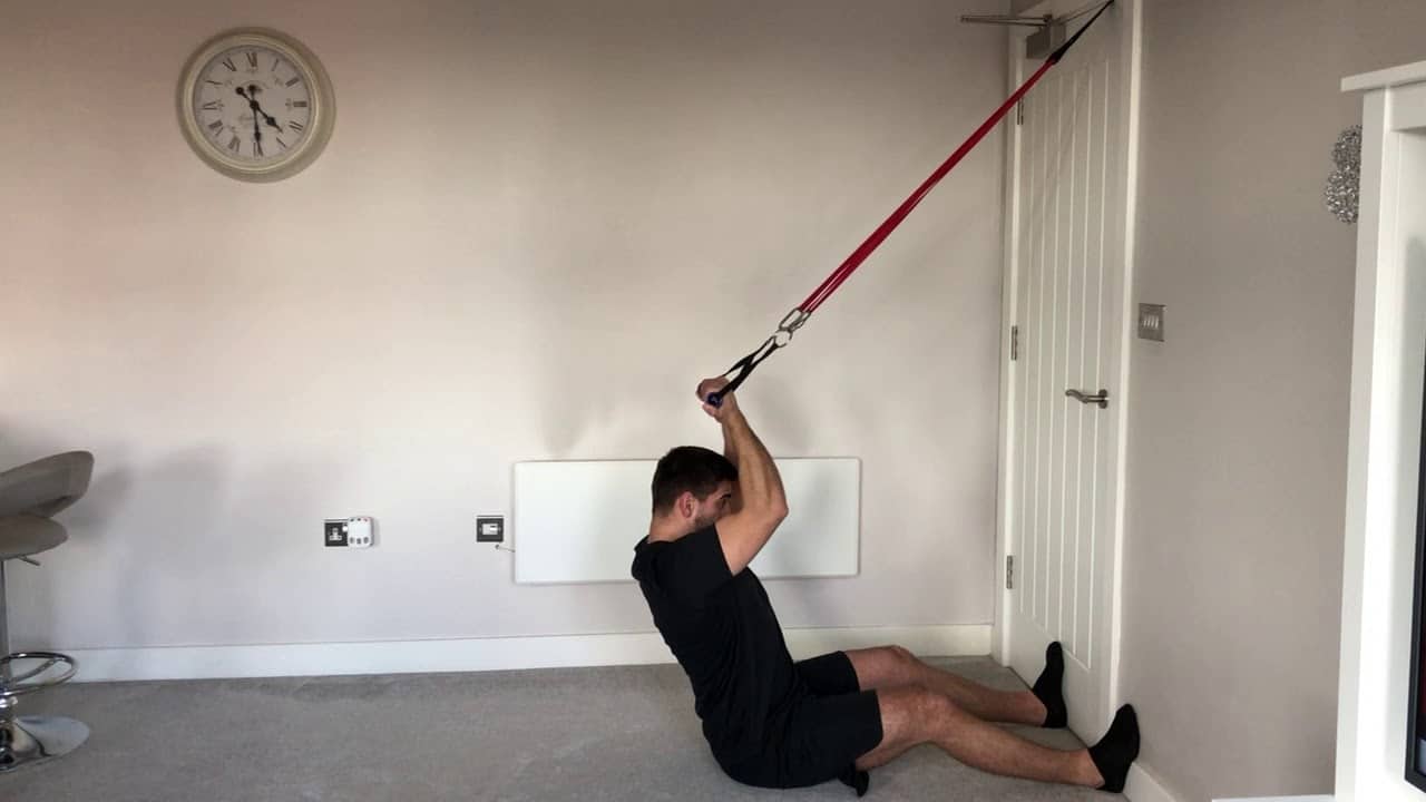 Man Doing Banded High Curls At Home