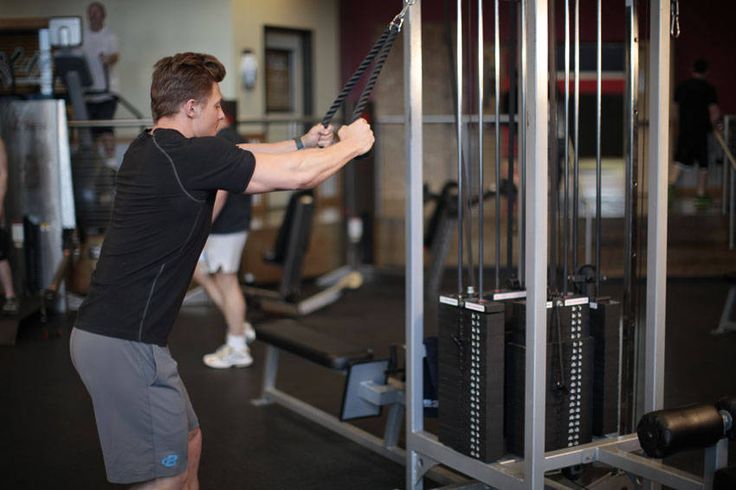 Man Doing Cable Rope Straight Pulldown Exercise