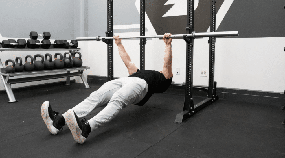 Man Doing Inverted Row Exercise In The Gym