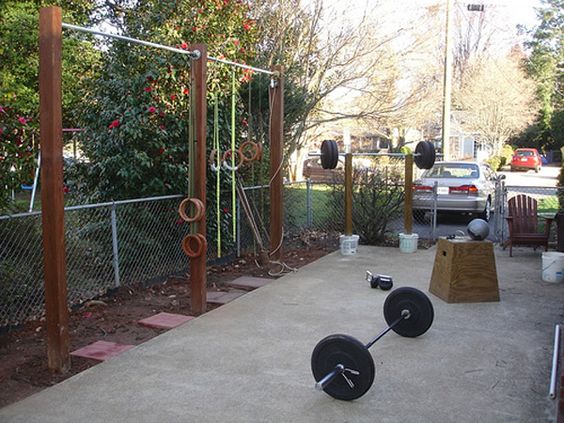 backyard gym with pull up bars and DIY squat rack
