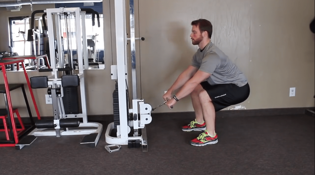 Man Doing Cable Machine Front Raise Exercise