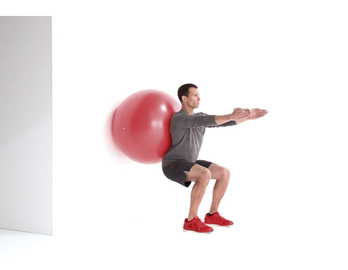 Man Doing Stability Ball Squat