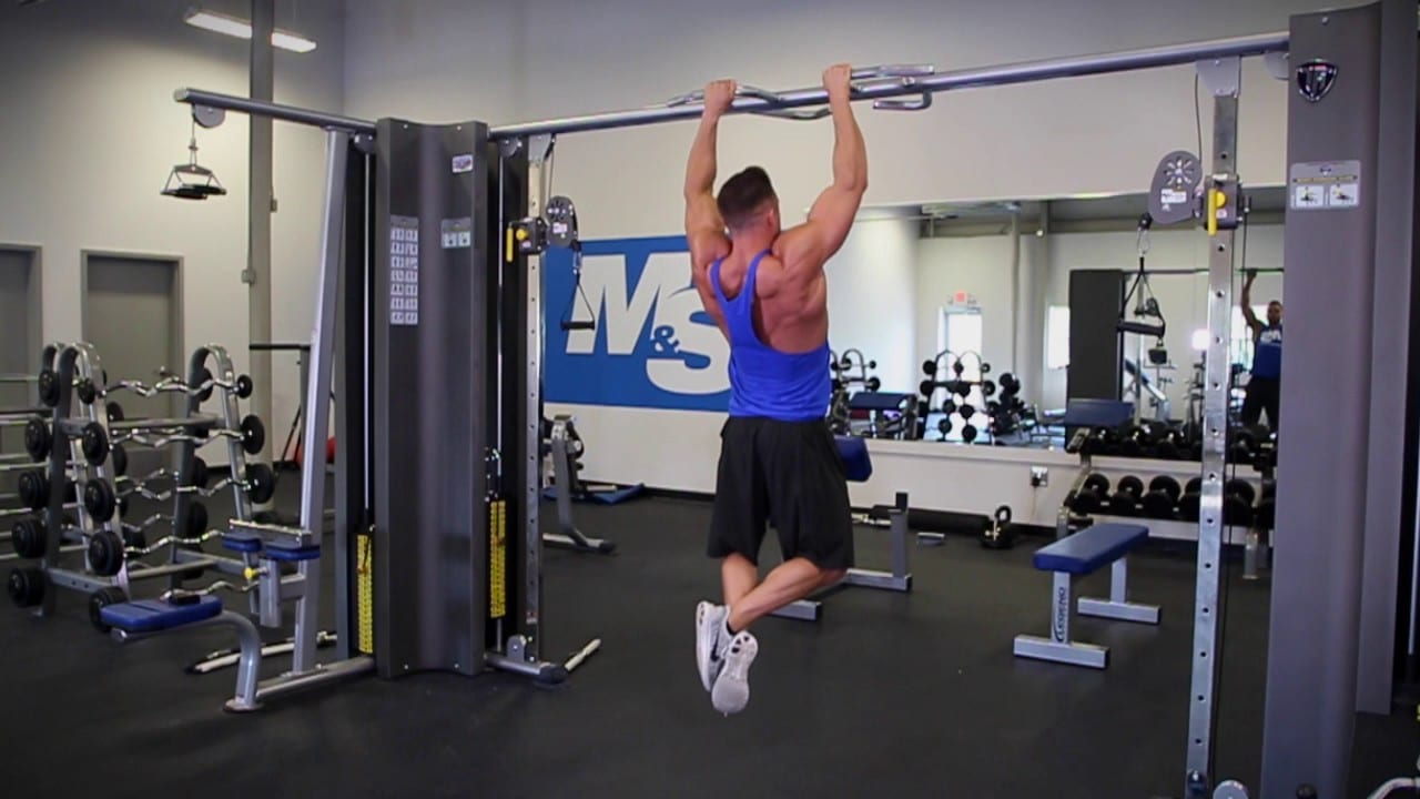 Man Doing Close Grip Pull Up Exercise In The Gym
