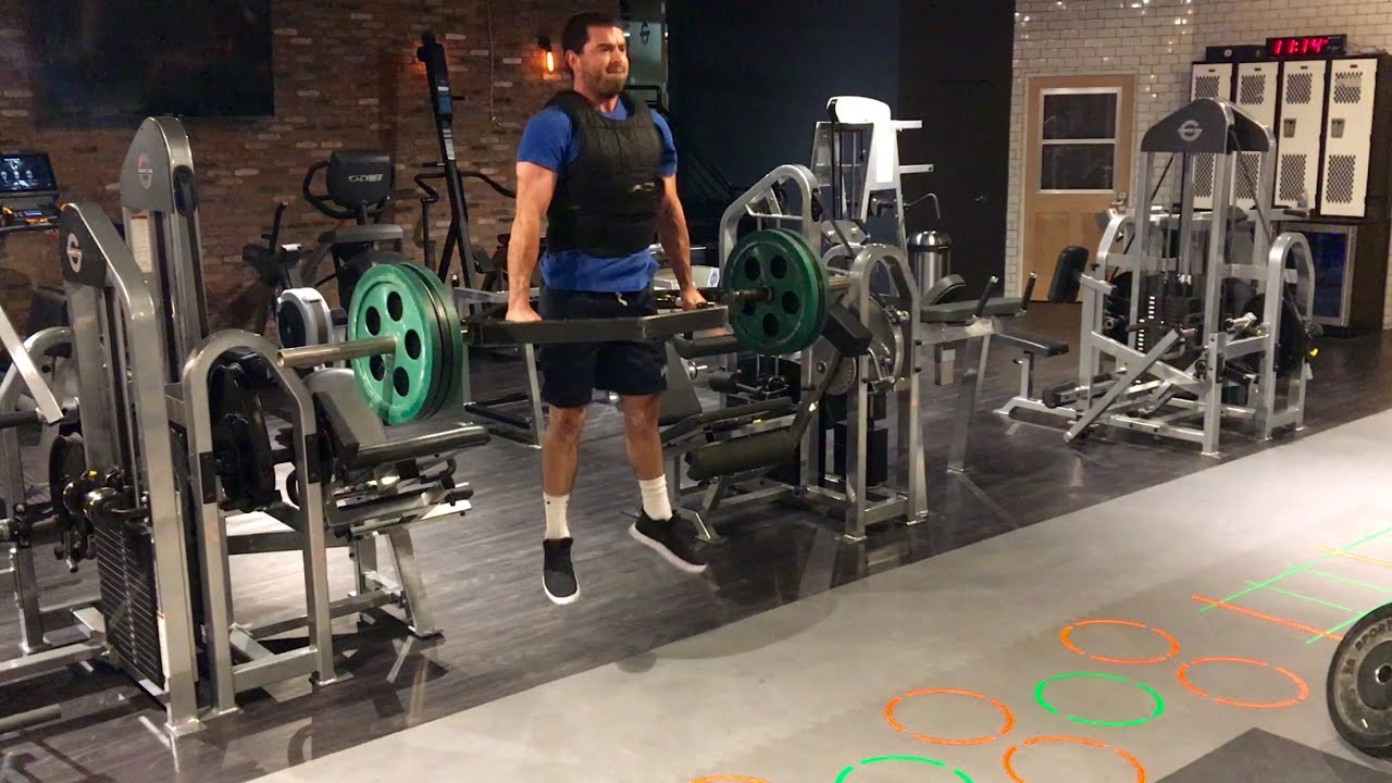 Man Performing Hex Bar Jump Exercise In The Gym