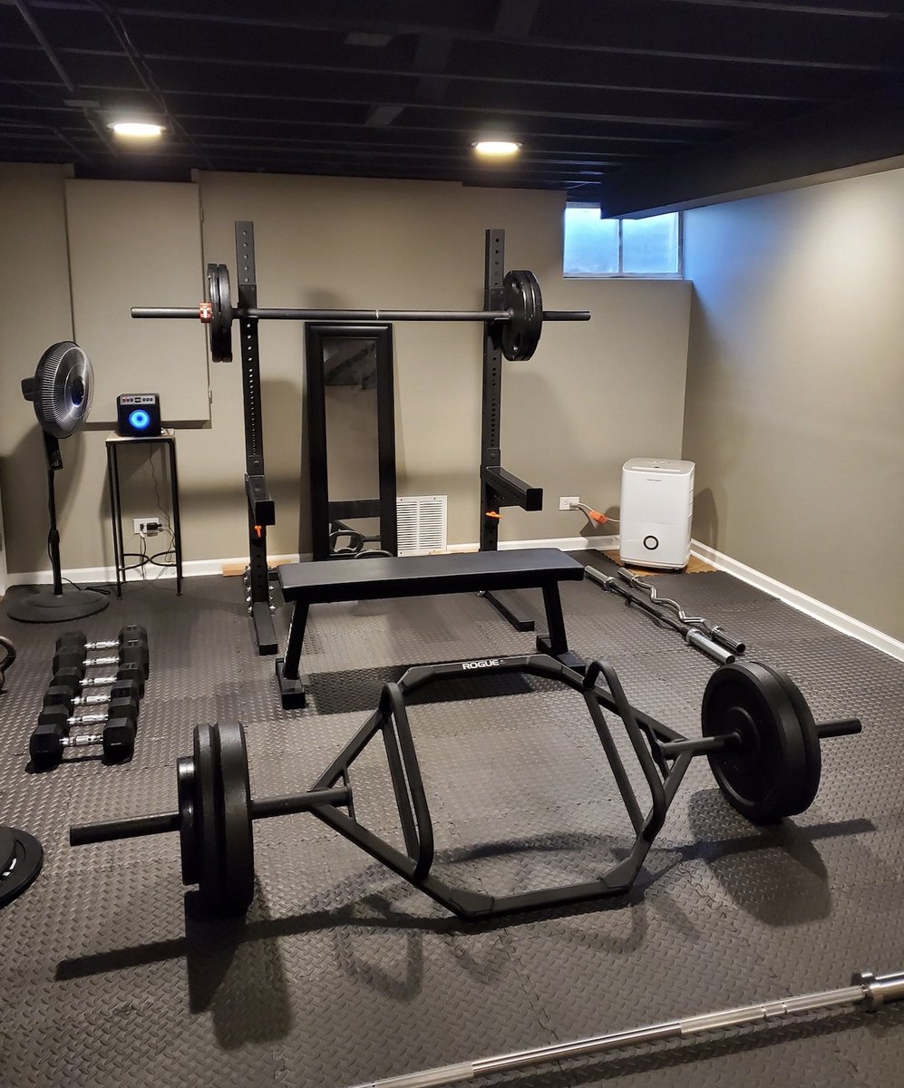basement gym with low ceiling and dehumidifier
