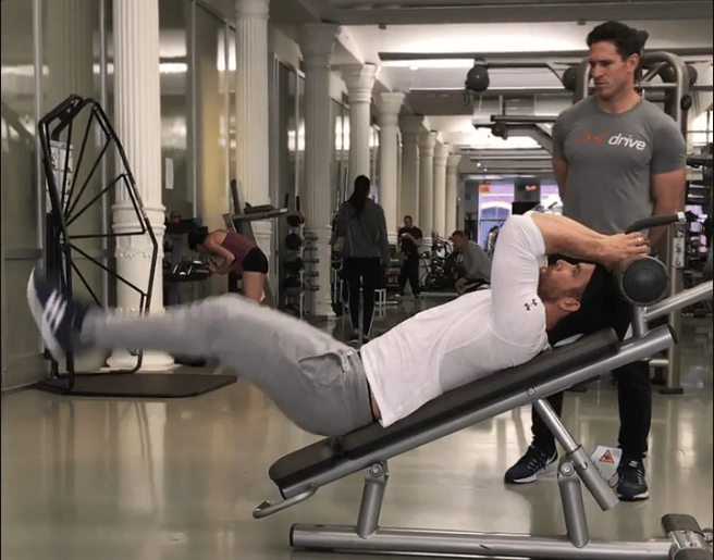 Ryan Reynolds Doing Reverse Leg Lift Crunches with Trainer