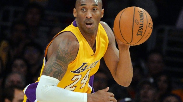 Kobe Bryant playing basketball for the Lakers