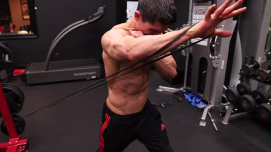 Man Doing Resistance Band Front Raise Exercise