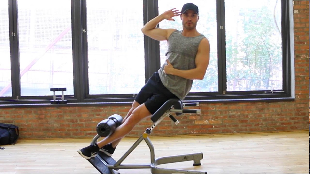 man doing roman chair Side Bend exercise