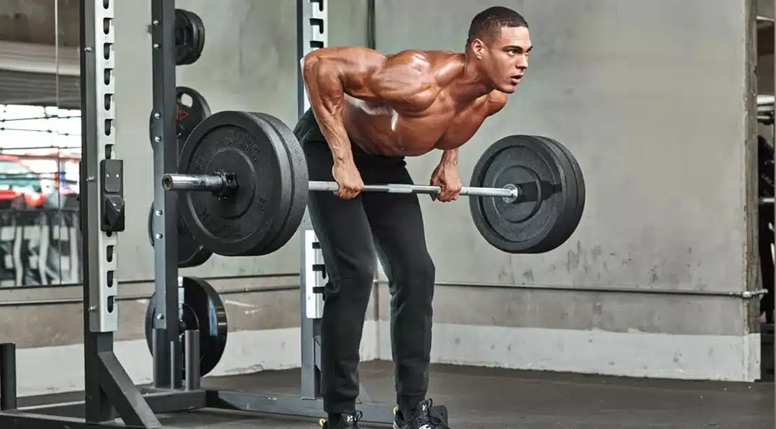 man doing a bent over barbell row